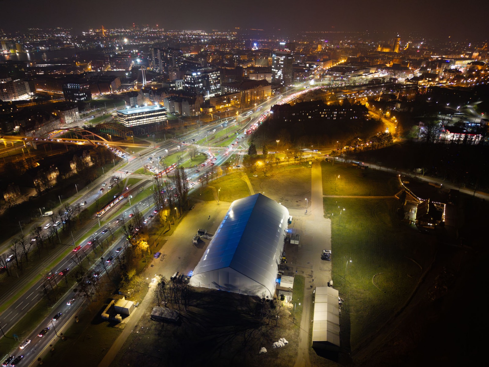 Tent structure installation photographed at night